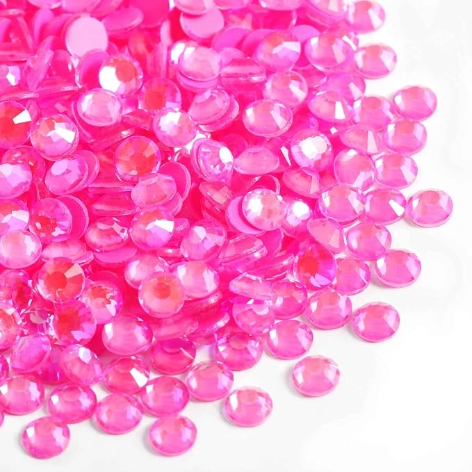 Pink rhinestones arranged on a pale surface