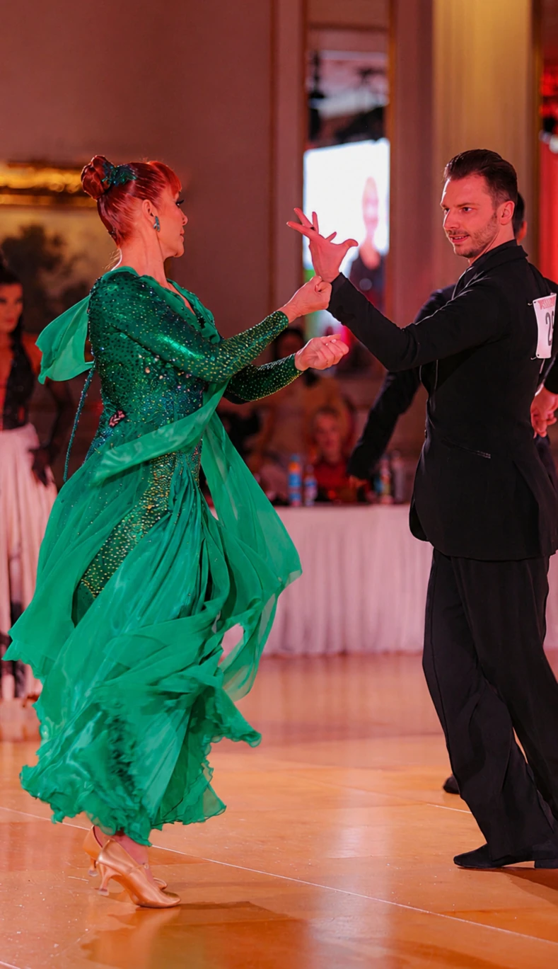 Dancer moving in the green Aurora gown