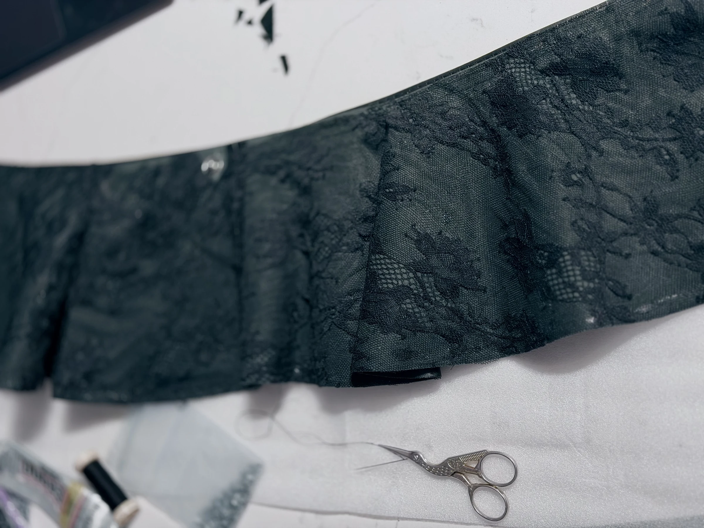 Black lace handwork in the studio